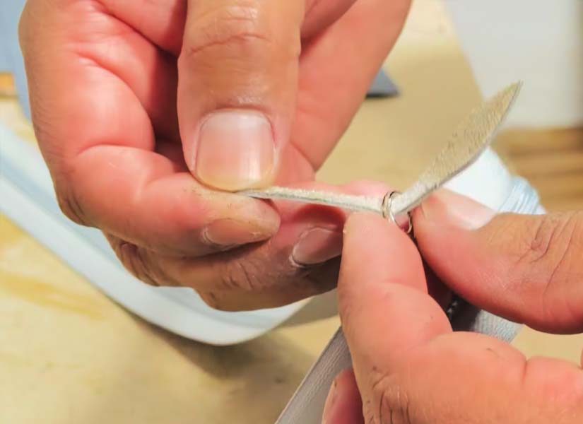 Hands assembling a cover in the Ministry Ideaz workshop